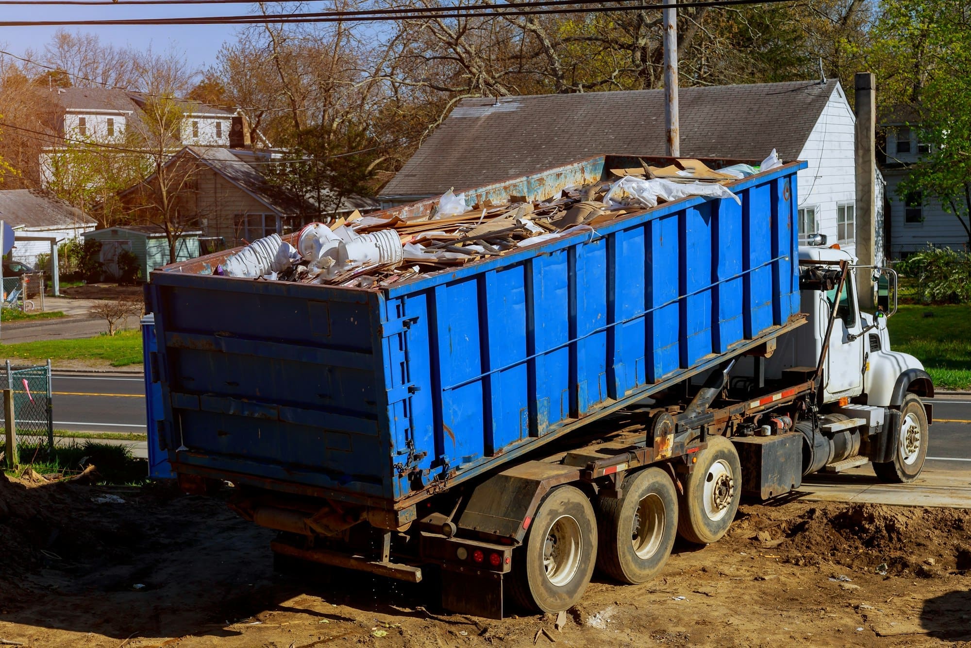 Recycling container trash dumpsters being full with garbage container trash on ecology and